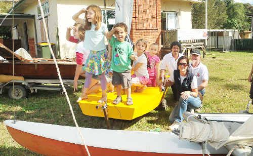 Urunga Sail Training Club members Rachael Case, Commodore Derek Ridgley and Klaus Dargo with donated boats and some keen young sailors. Urunga Sail Training Club members Rachael Case, Commodore Derek Ridgley and Klaus Dargo with donated boats and some keen young sailors.
